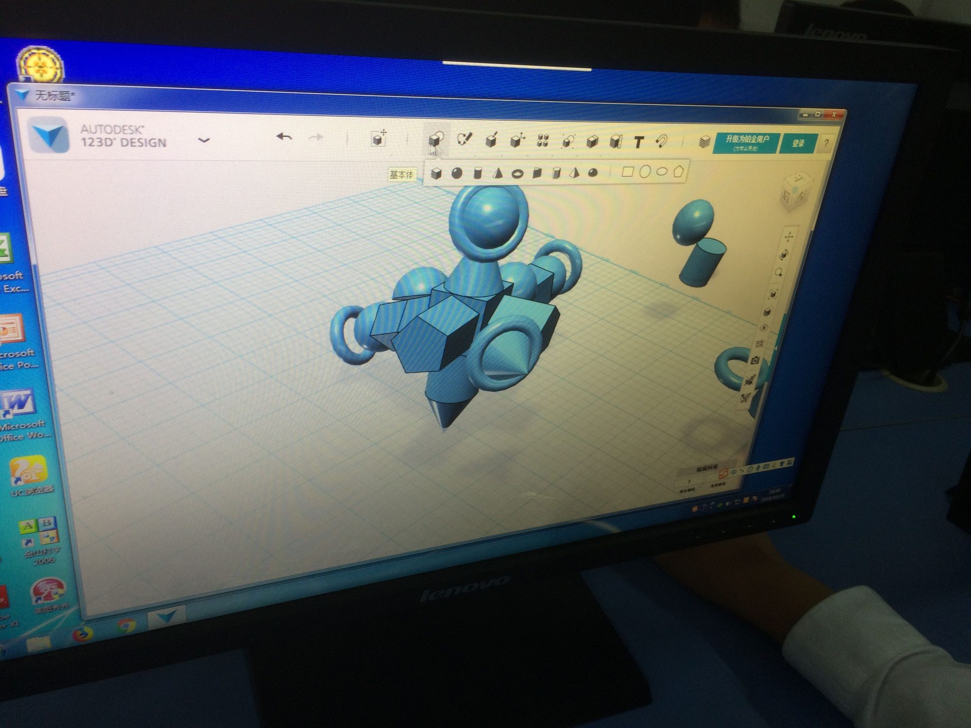 Monitor showing a blue 3D robot figure built in 123D Design