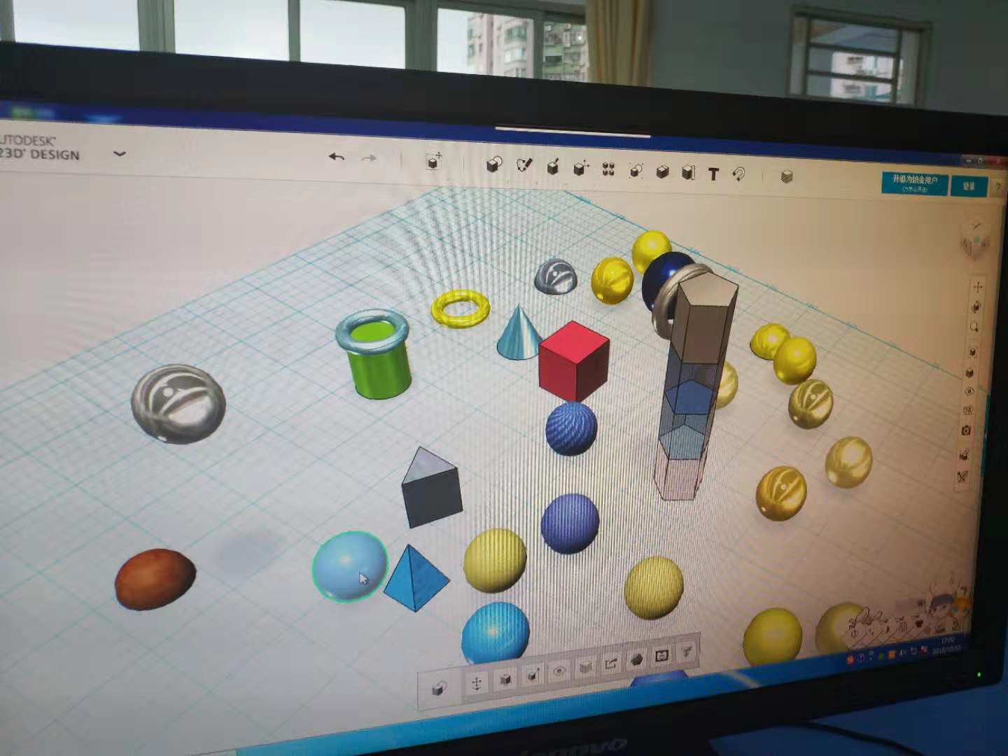 Monitor displaying colorful 3D shapes in modeling software