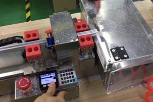 Aluminum extrusion cutting rig with an M5 controller and touchscreen panel
