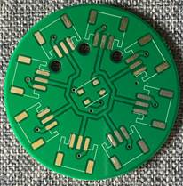 Close-up of a round green LED breakout circuit board