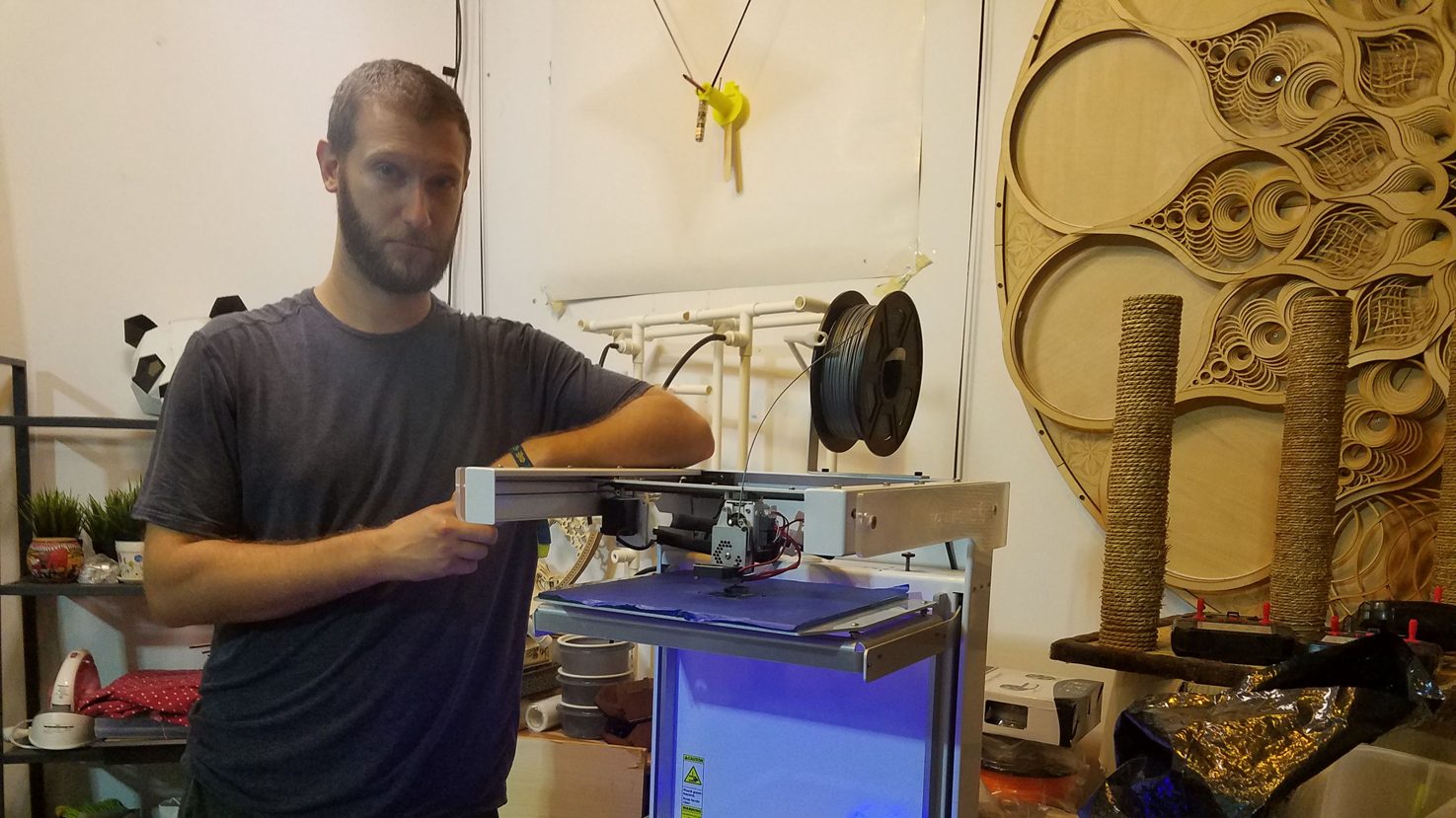 Jonathan working with a 3D printer