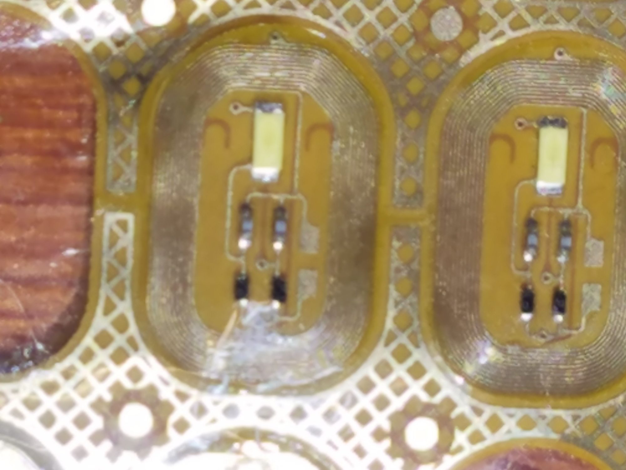 Macro shot of an NFC antenna circuit with LEDs on flexible PCB