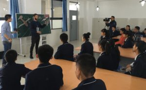 Instructor leading a workshop discussion with seated students