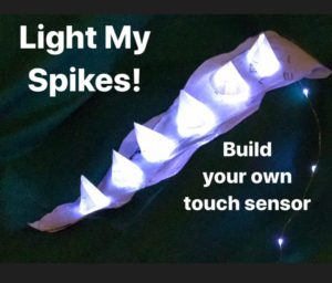 Illuminated dino spikes with text 'Light My Spikes! Build your own touch sensor'
