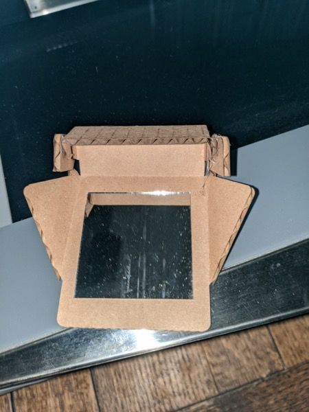 Assembled cardboard document camera reflector with mirror insert