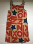 Paper campaign dress printed with 'NIXON' and stars