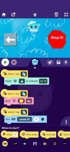 OctoStudio app screen with a snowman character and stop button