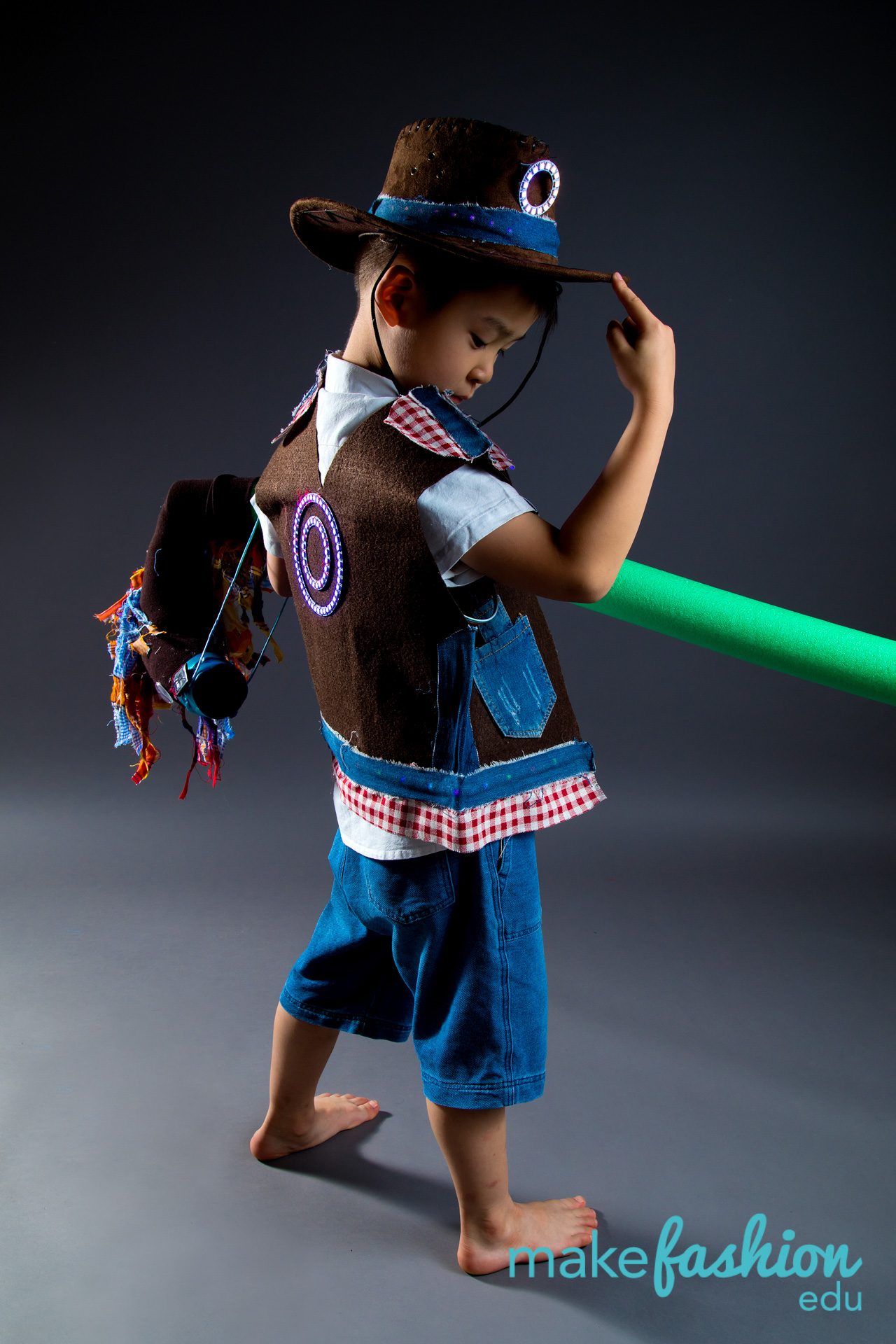 Student designer wearing a lighted hoop piece