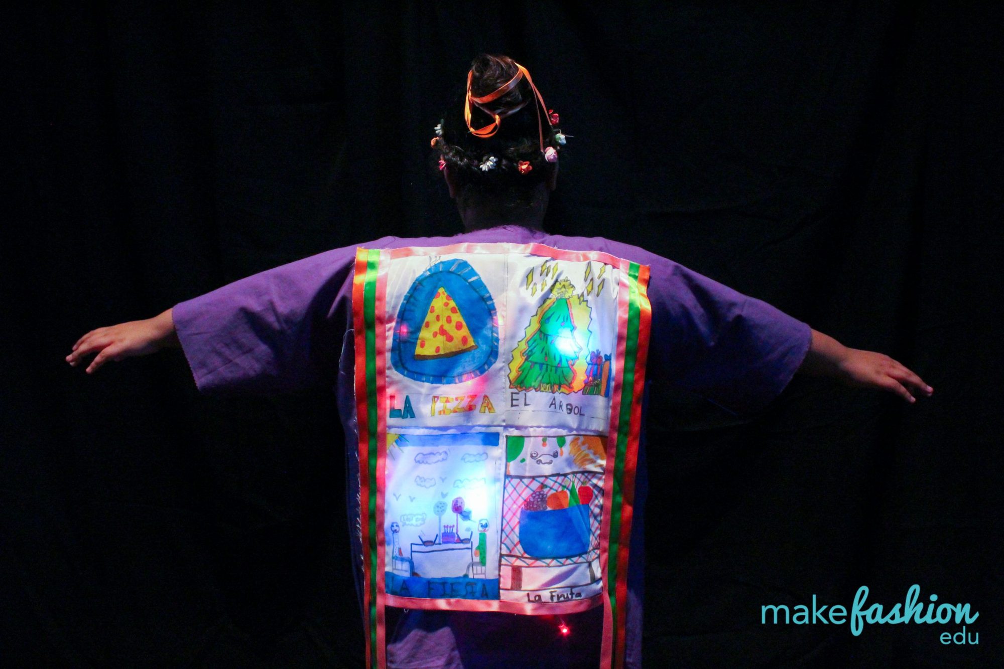 Back of a purple robe with hand-illustrated glowing fabric panels