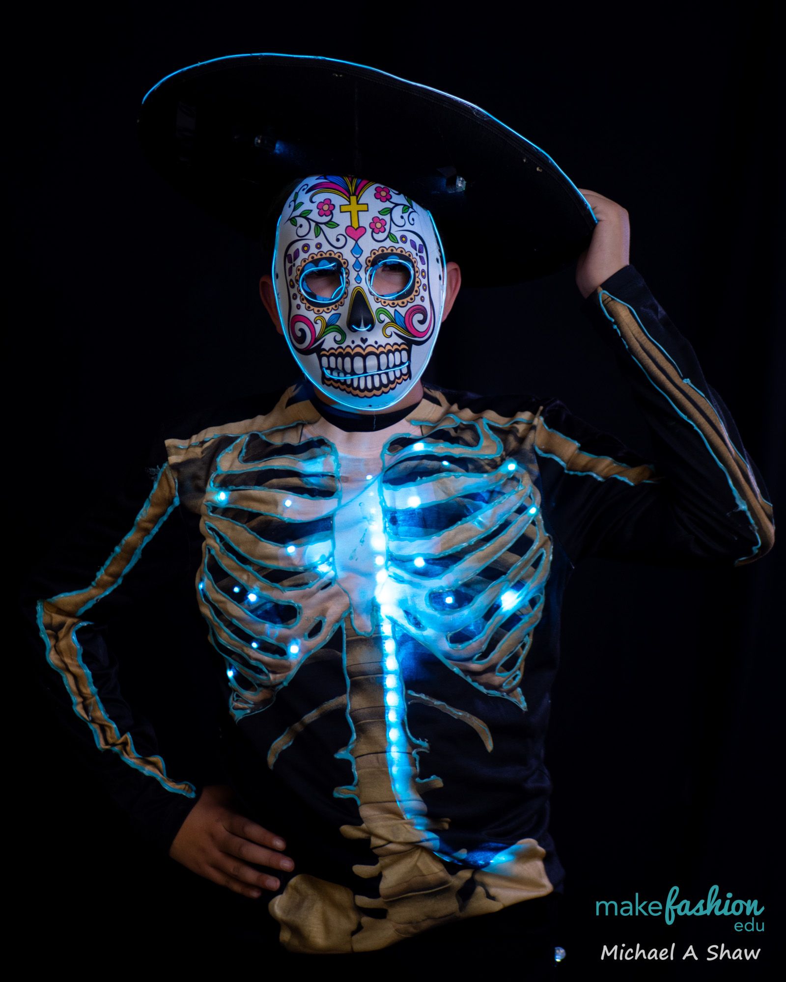 Student in skeleton costume with glowing blue LED lights
