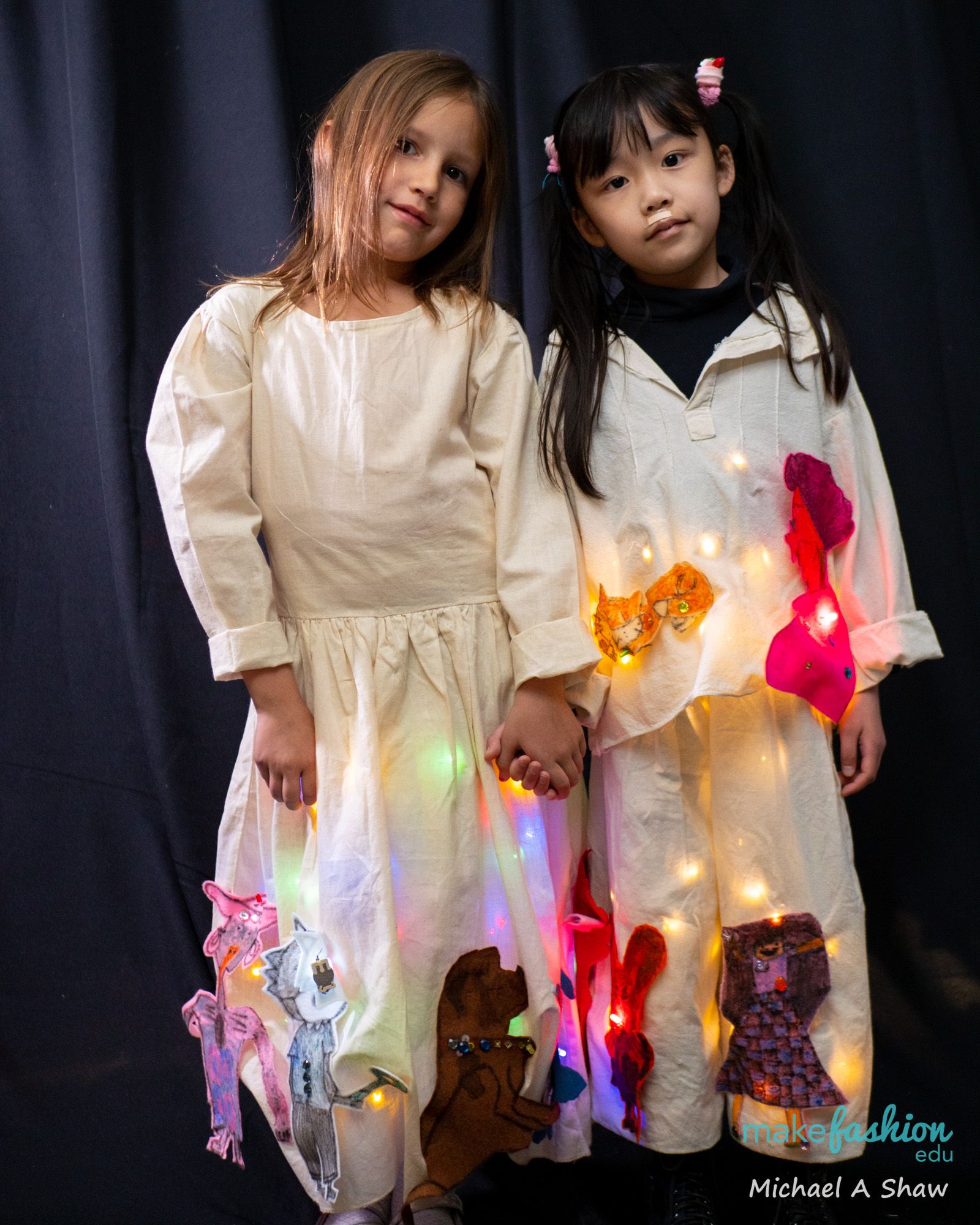 Student model in an embroidered folklorico dress with a glowing sugar skull mask
