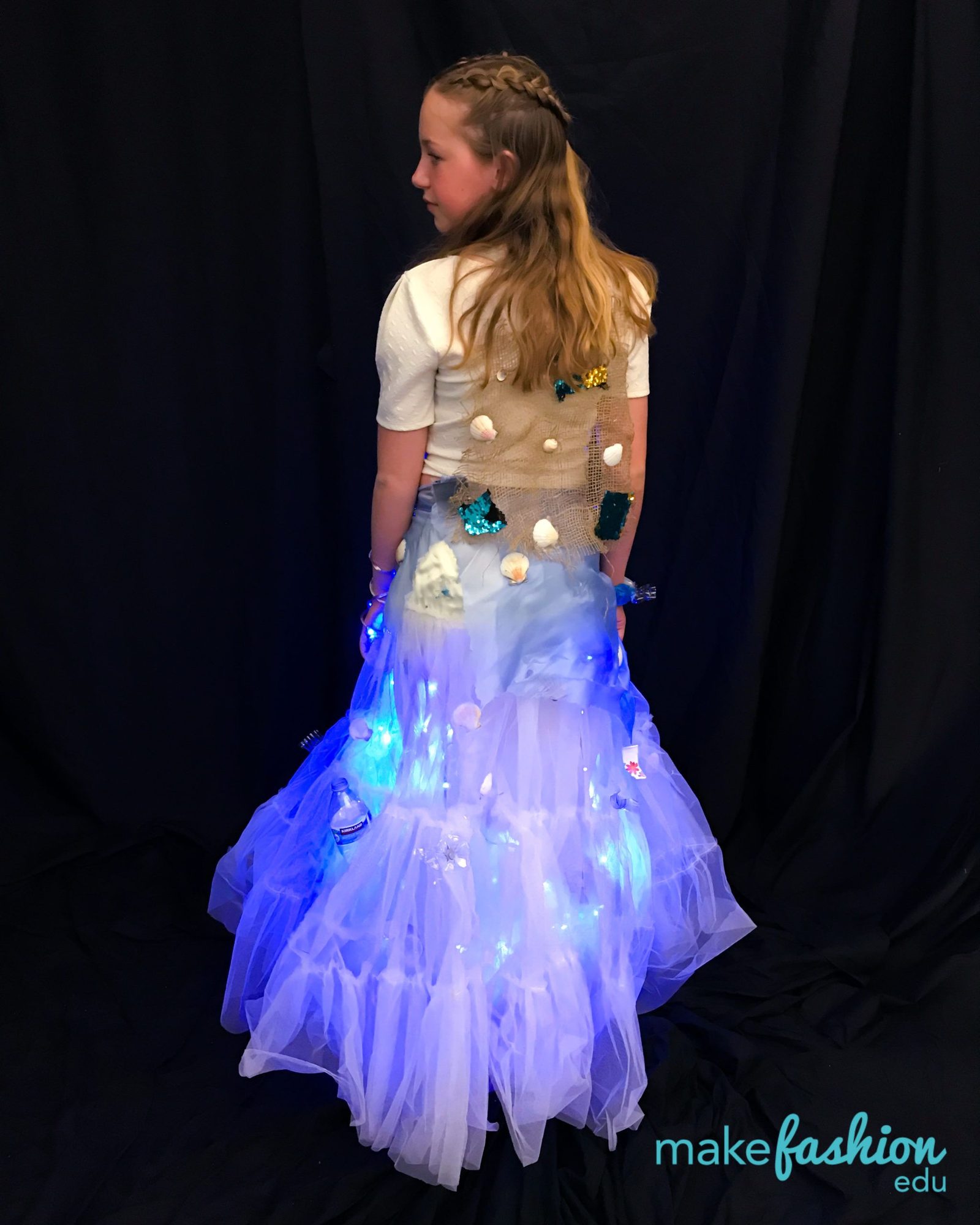 Back view of a tulle skirt with seashells and blue LED lighting