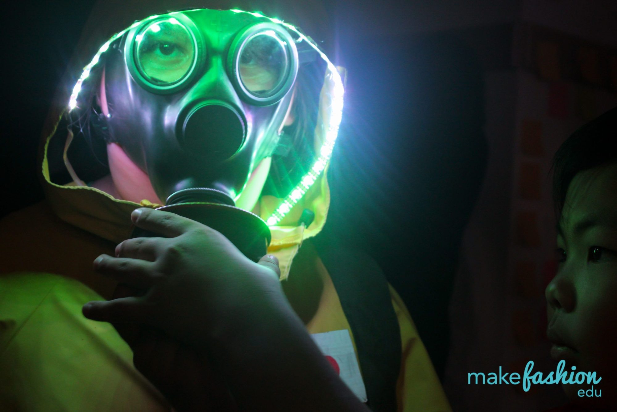 Close-up of a green LED-rimmed gas mask