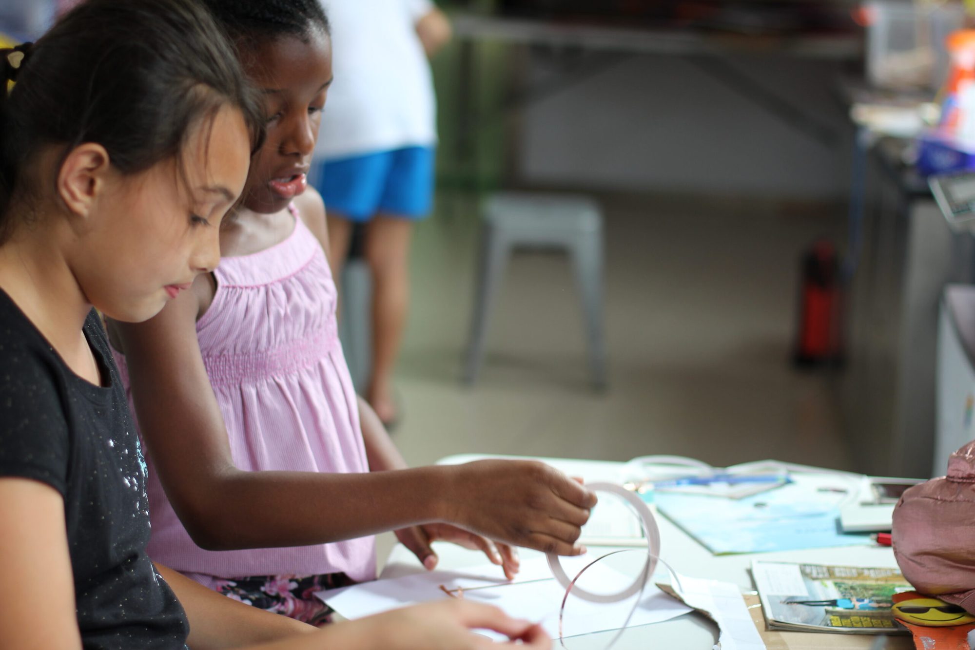 Two students working together at a classroom table