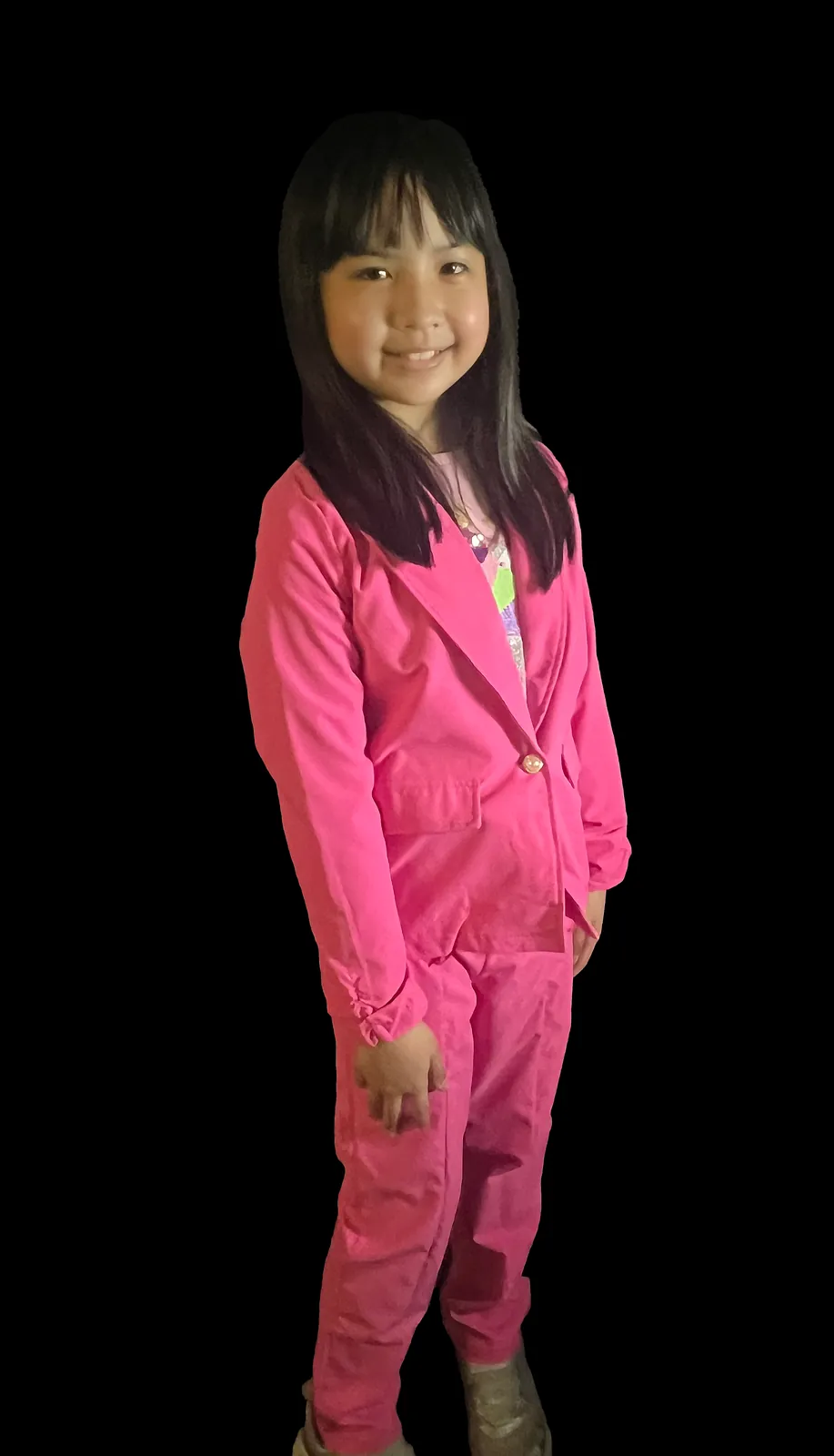 Student as Kamala Harris in a bright pink pantsuit