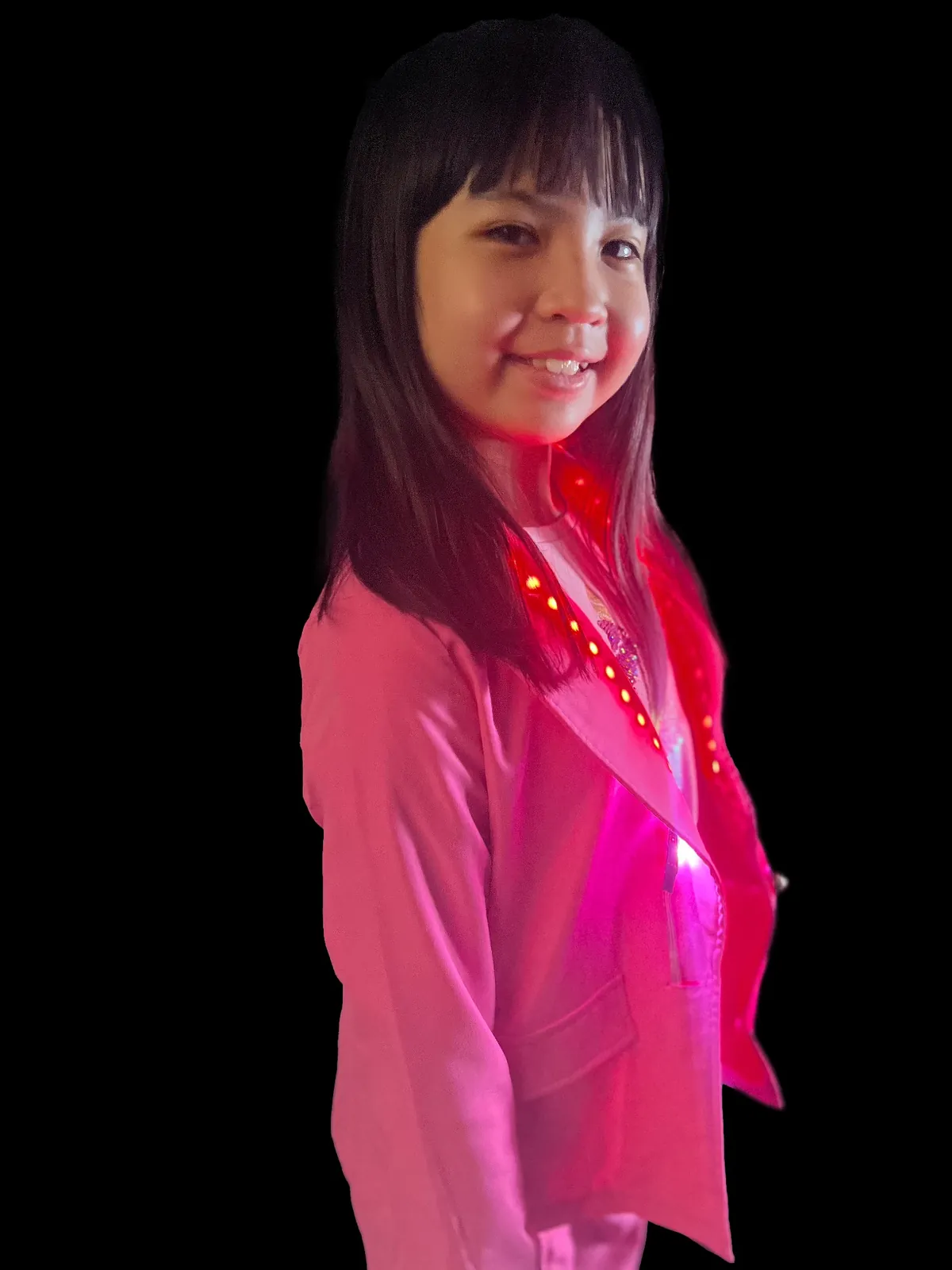 Student as Kamala Harris smiling in a pink blazer with red LEDs glowing along the lapels