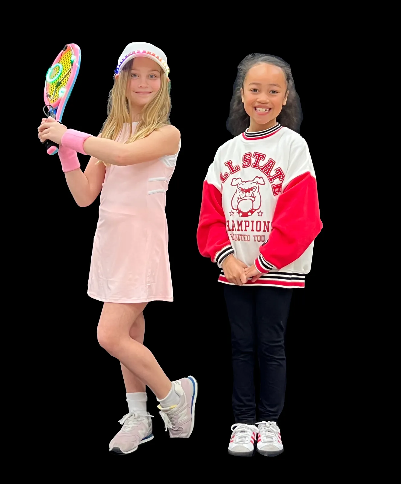Two students side by side, one as Naomi Osaka with a light-up tennis racket and visor, the other in a red and white varsity jacket