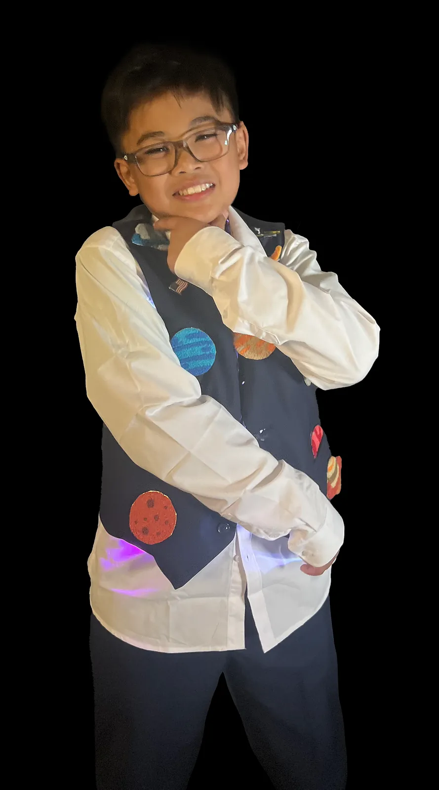 Student as Neil deGrasse Tyson in a white shirt and a vest covered in glowing planets