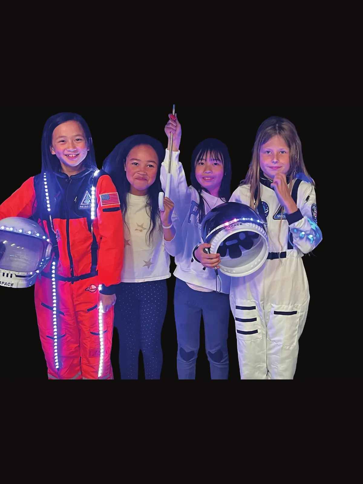 Four students in orange and white astronaut suits with LED trim, holding space helmets, for Mae Jemison