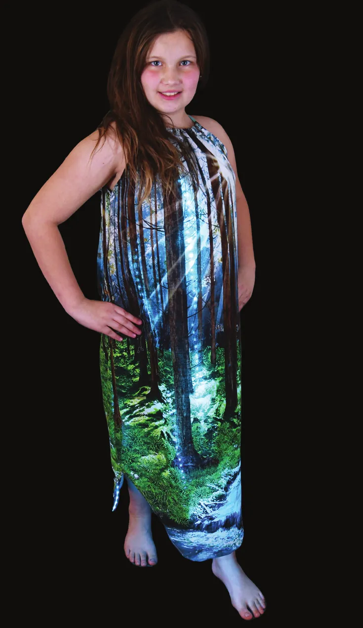 Evergreen: student in a halter dress printed with a forest of tall green trees