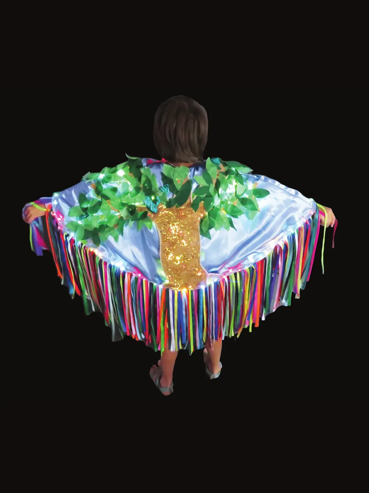 Falling Leaves: back view of a wide white cape painted with a golden tree and green leaves, fringed with rainbow ribbons
