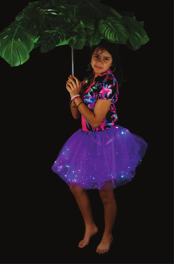 Flora: student under a leafy umbrella in a floral top and glowing purple tutu