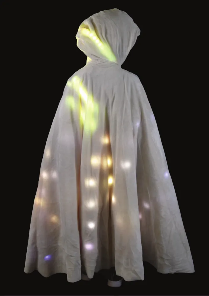 Northern Lights: hooded cream cape glowing with scattered white and green lights