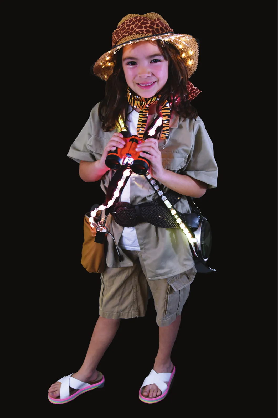 Safari: student in a khaki safari outfit and leopard-print hat, holding binoculars