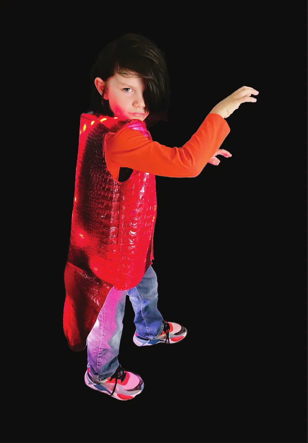 See Ya Later, Alligator: student in a glowing red outfit, arms outstretched