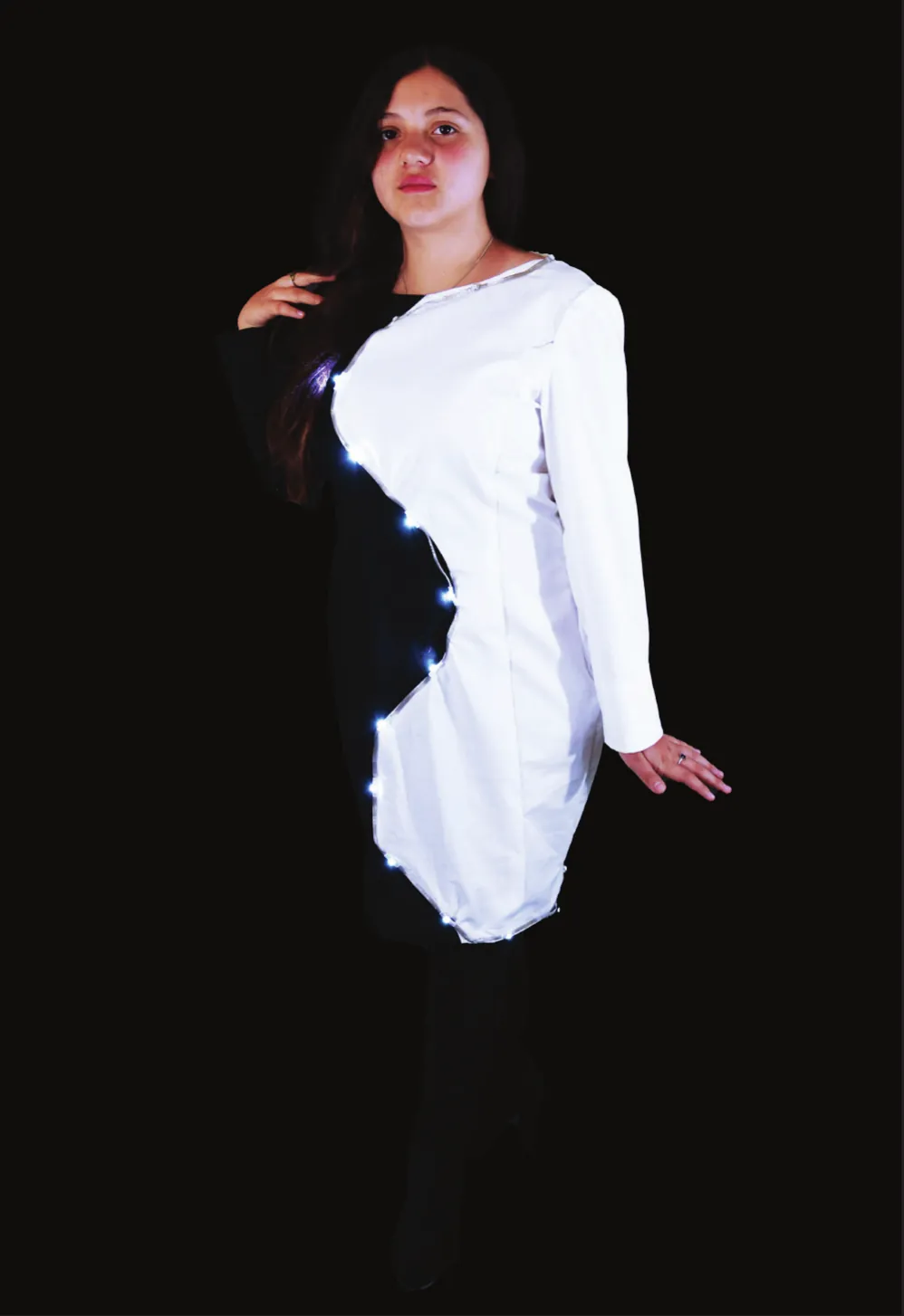 Yin Yang Gender Equality: student in a shift dress split into black and white halves along a curved line of lights
