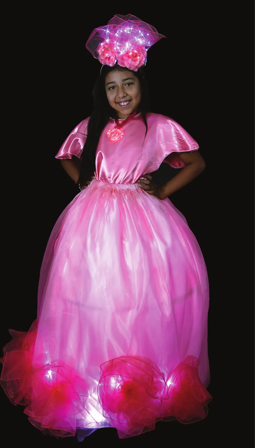 By Any Other Name: student in a pink rose-inspired gown with a lit flower headpiece and glowing pink hem