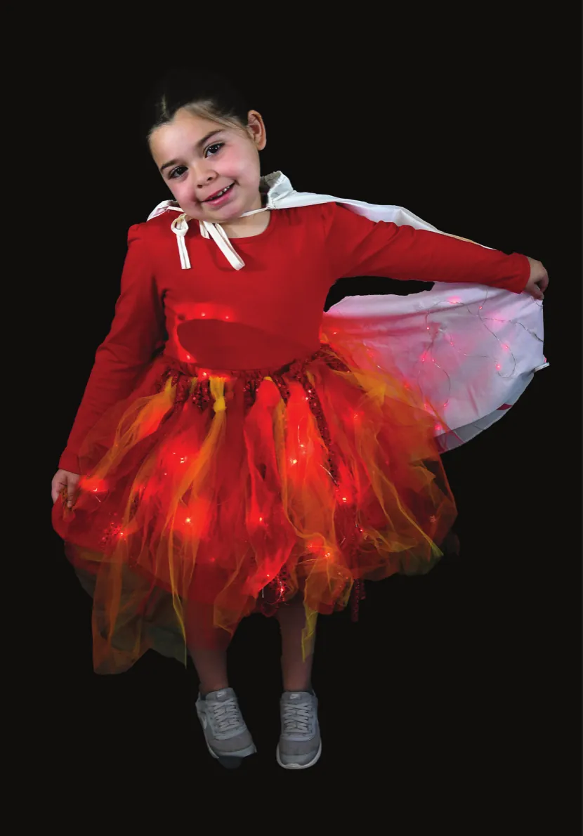 Flaming Hot: student in a red top and a red and orange tulle skirt that glows like flames