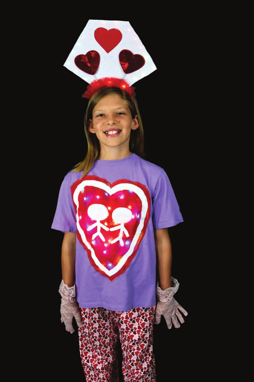 P2P: student in a purple T-shirt with a heart of two linked figures and a headband of red hearts