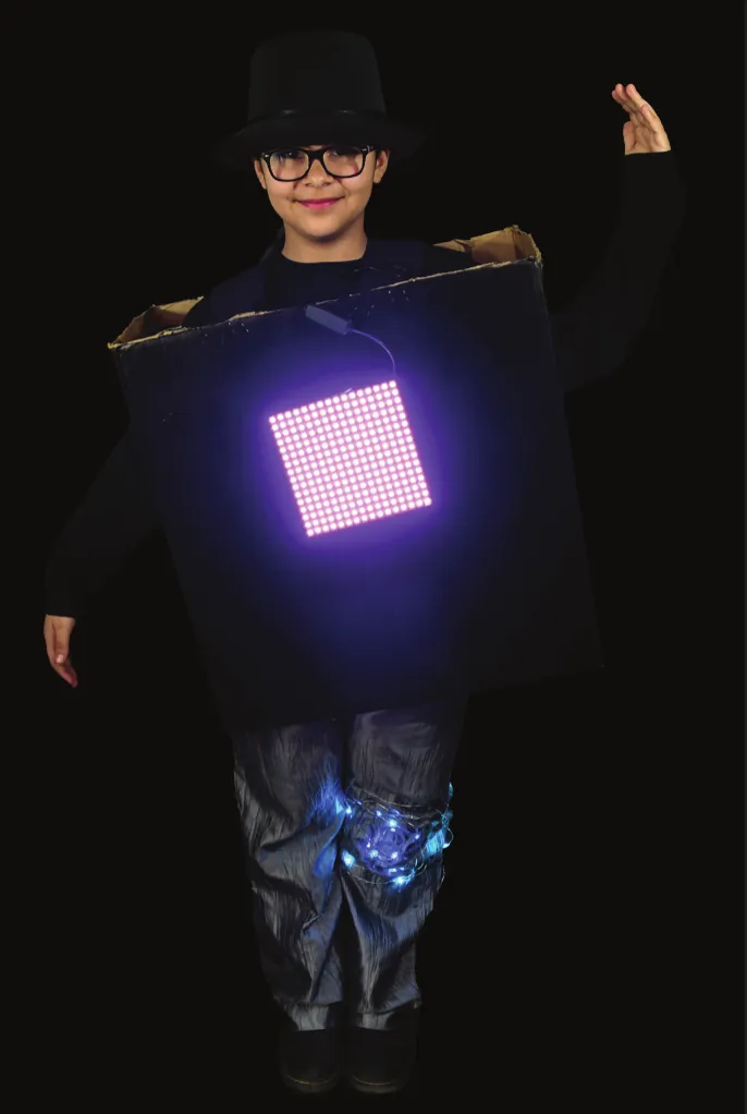 Robot²: student in a black box robot costume with a glowing purple LED matrix screen
