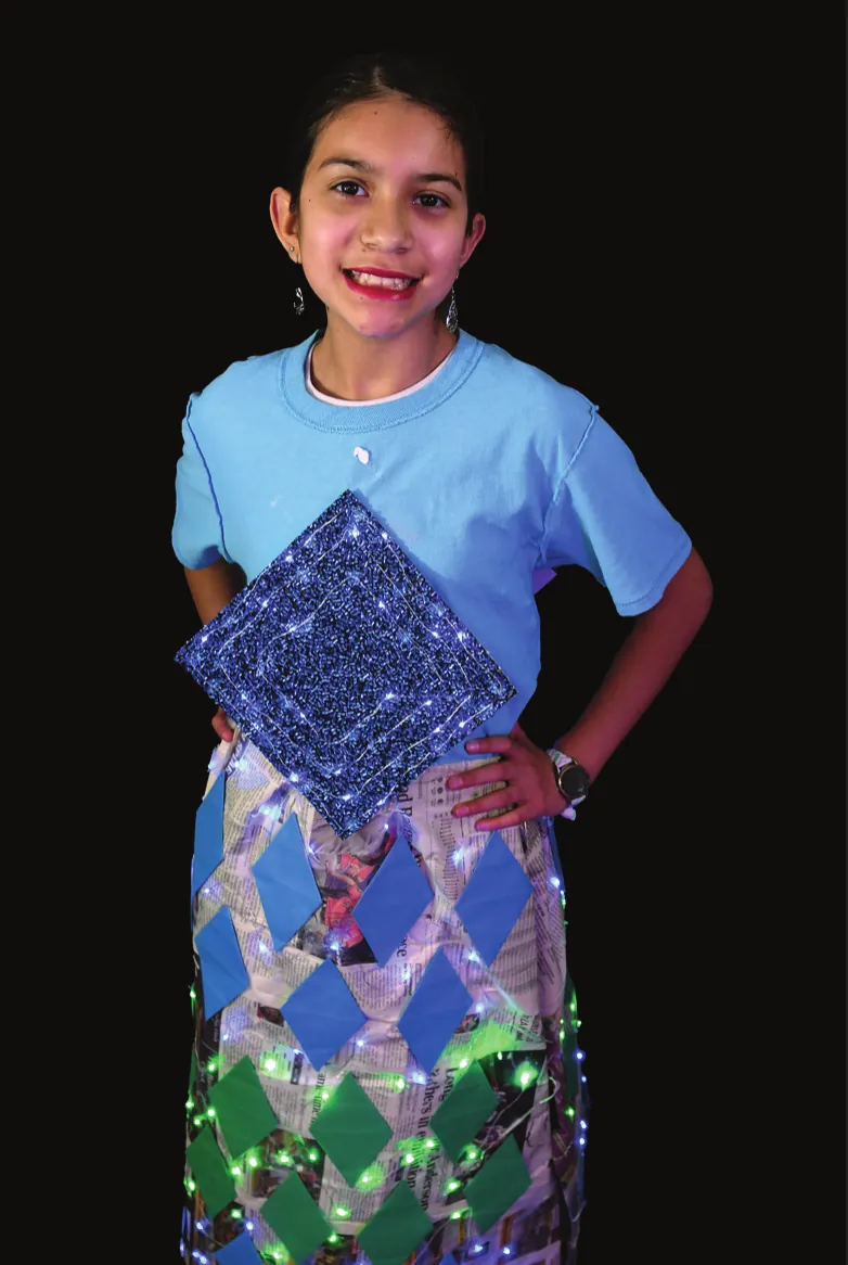 Shining Armor: student in a blue T-shirt and a skirt of mirrored diamond panels with a sequined diamond on the front