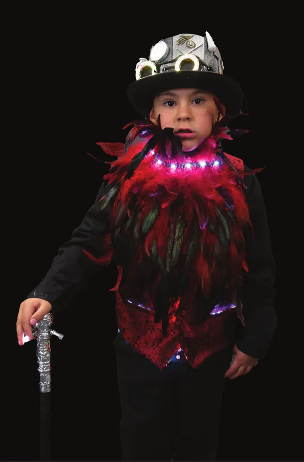 Vermillion: student in a black top hat, holding a cane, with red feathers and lights at the collar